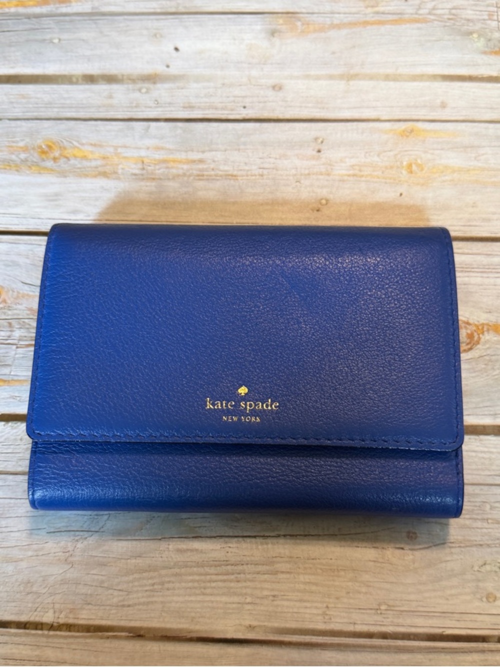kate spade cobalt blue leather bifold wallet with gold logo